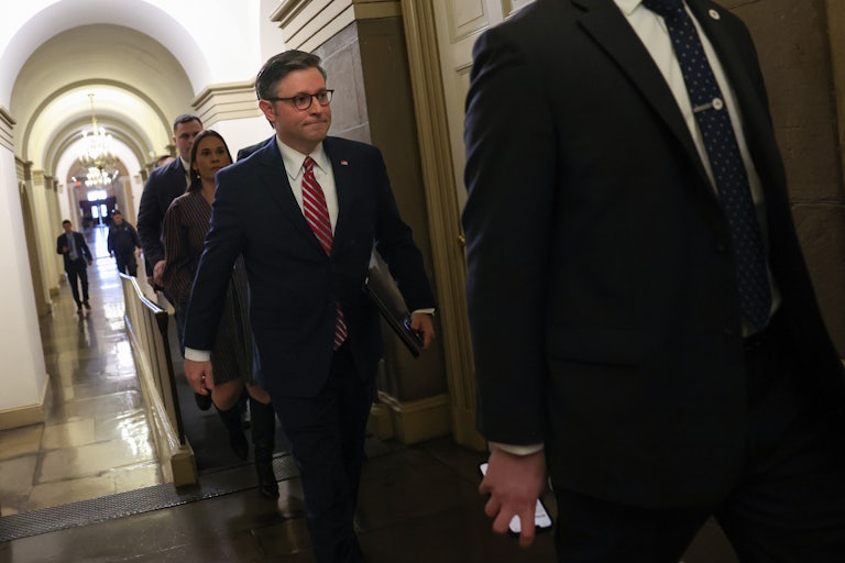 Mike Johnson walks through the Capitol
