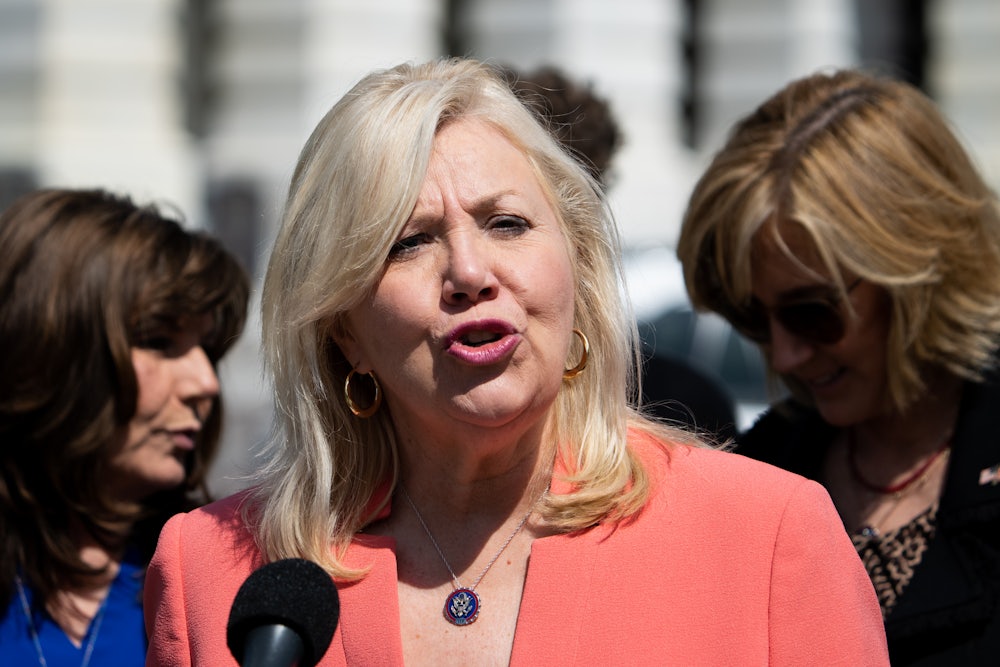 Debbie Lesko speaks into a microphone.