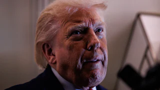 Donald Trump tucks his bottom lip and looks up while speaking to reporters on Air Force One