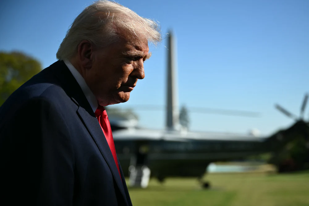 Donald Trump speaks with reporters prior to boarding Marine One.