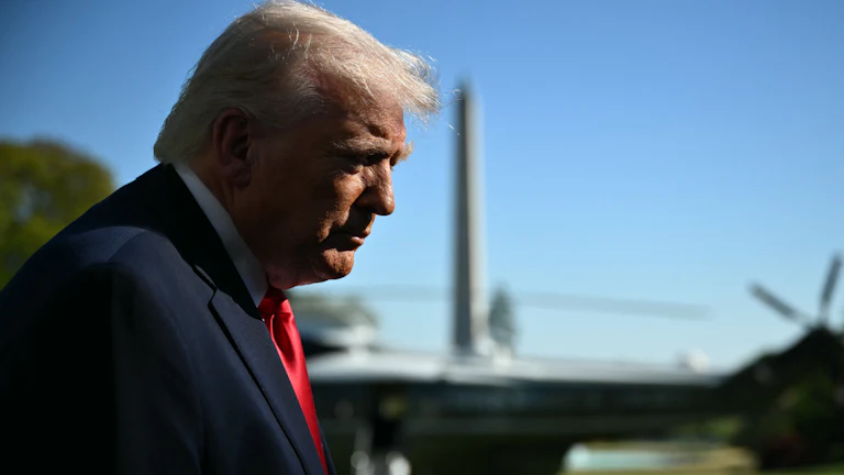 Donald Trump speaks with reporters prior to boarding Marine One.