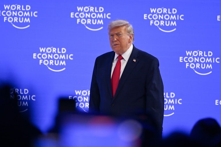 Donald Trump walks on stage at the World Economic Forum in Davos.