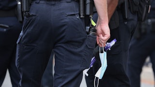 police officer carrying mask