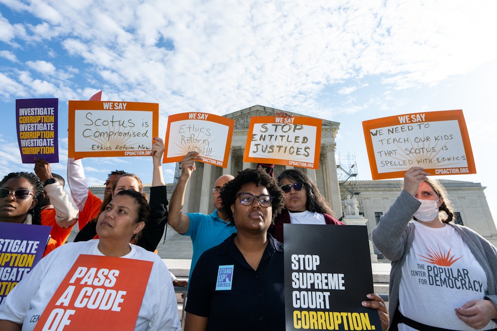 Demonstrators hold a press conference in front of the Supreme Court calling on Senate leadership to pass a binding code of ethics for Supreme Court justices.