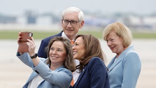 Kamala Harris gathers for a picture with top Wisconsin Democratic office-holders, including Senator Tammy Baldwin, right.