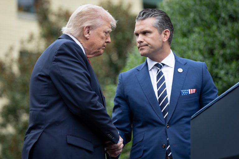 Donald Trump and Defense Secretary Pete Hegseth frown while shaking hands