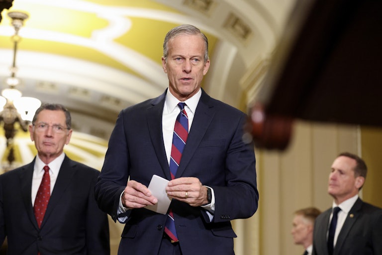 Senate Majority Leader John Thune walks in the Capitol