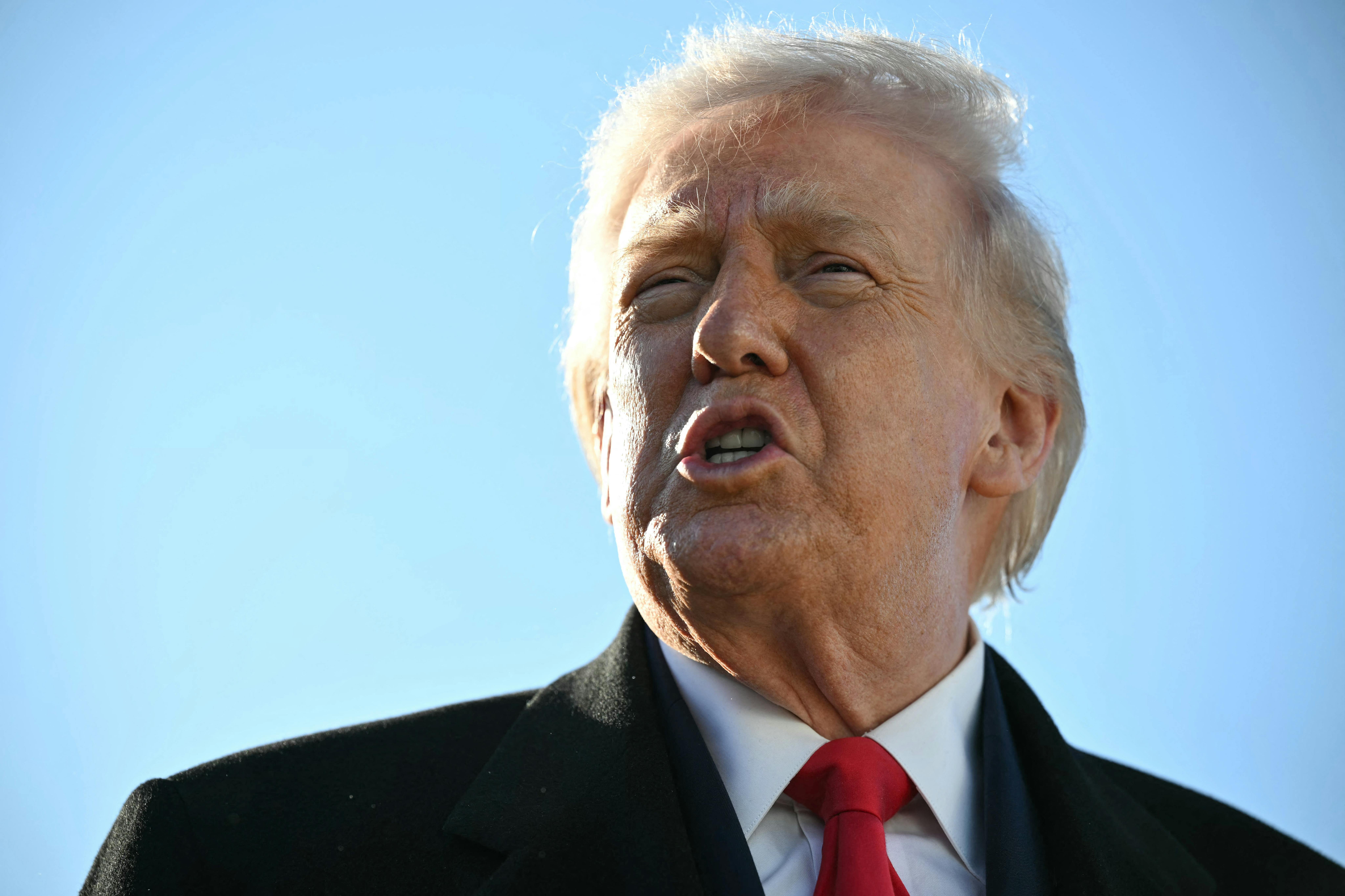 President Donald Trump speaks to the press before boarding Air Force One.