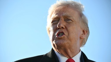President Donald Trump speaks to the press before boarding Air Force One.