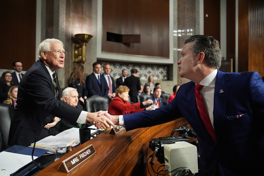 President-elect Donald Trump's nominee for Secretary of Defense Pete Hegseth greets Senate Armed Services Committee Chairman Sen. Roger Wicker during his confirmation hearing on Capitol Hill on January 14, 2025.