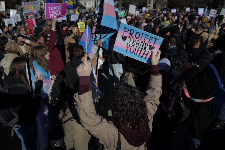 People protest in support of transgender kids outside the Supreme Court in Washington, D.C.