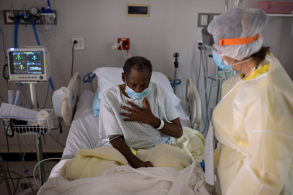 A health care worker tends to a Covid-19 patient in Houston.