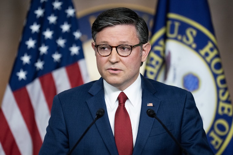 House Speaker Mike Johnson speaks at a podium