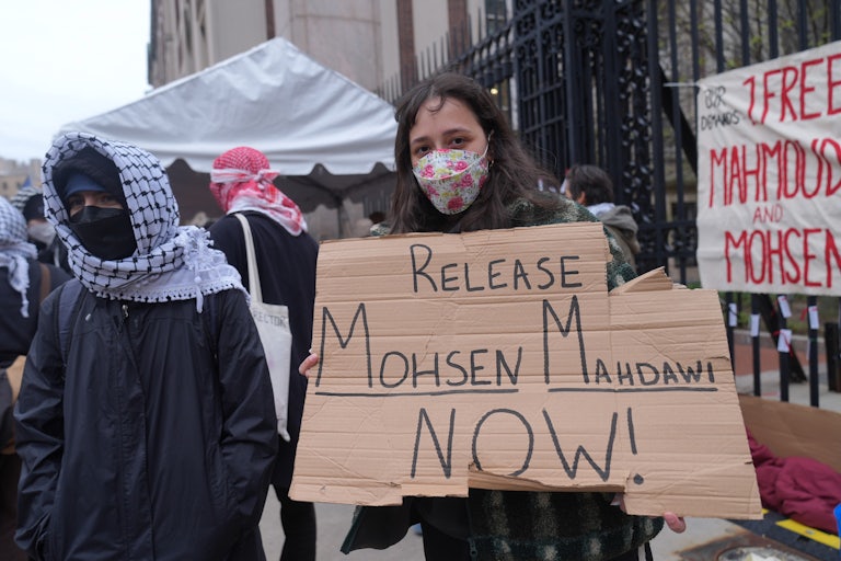 A person holds up a sign that says, "Release Mohsen Mahdawi now!" during an anti-ICE protest outside Columbia University