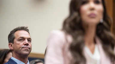 Bryon Noem listens to then-DHS Secretary Kristi Noem as she testifies in Congress.