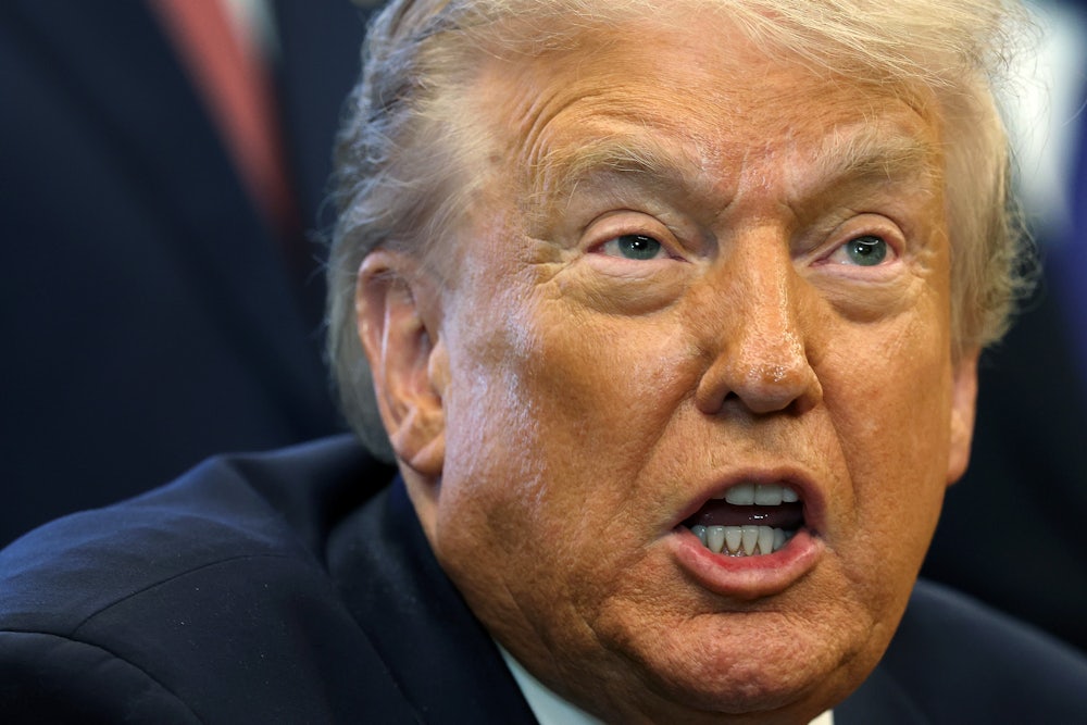 Donald Trump stares and grimaces while talking