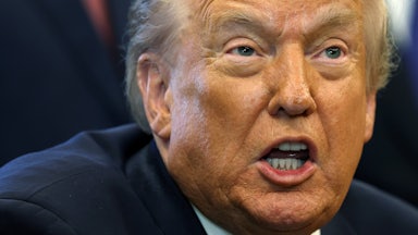 Donald Trump stares and grimaces while talking