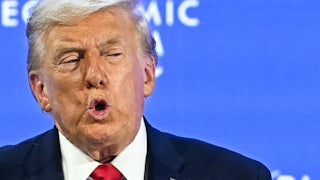 Donald Trump puckers his lips while speaking during the World Economic Forum in Davos