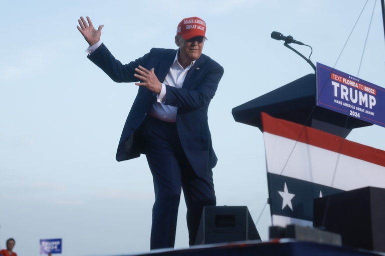 Donald Trump dances weirdly on stage at a campaign rally in Florida