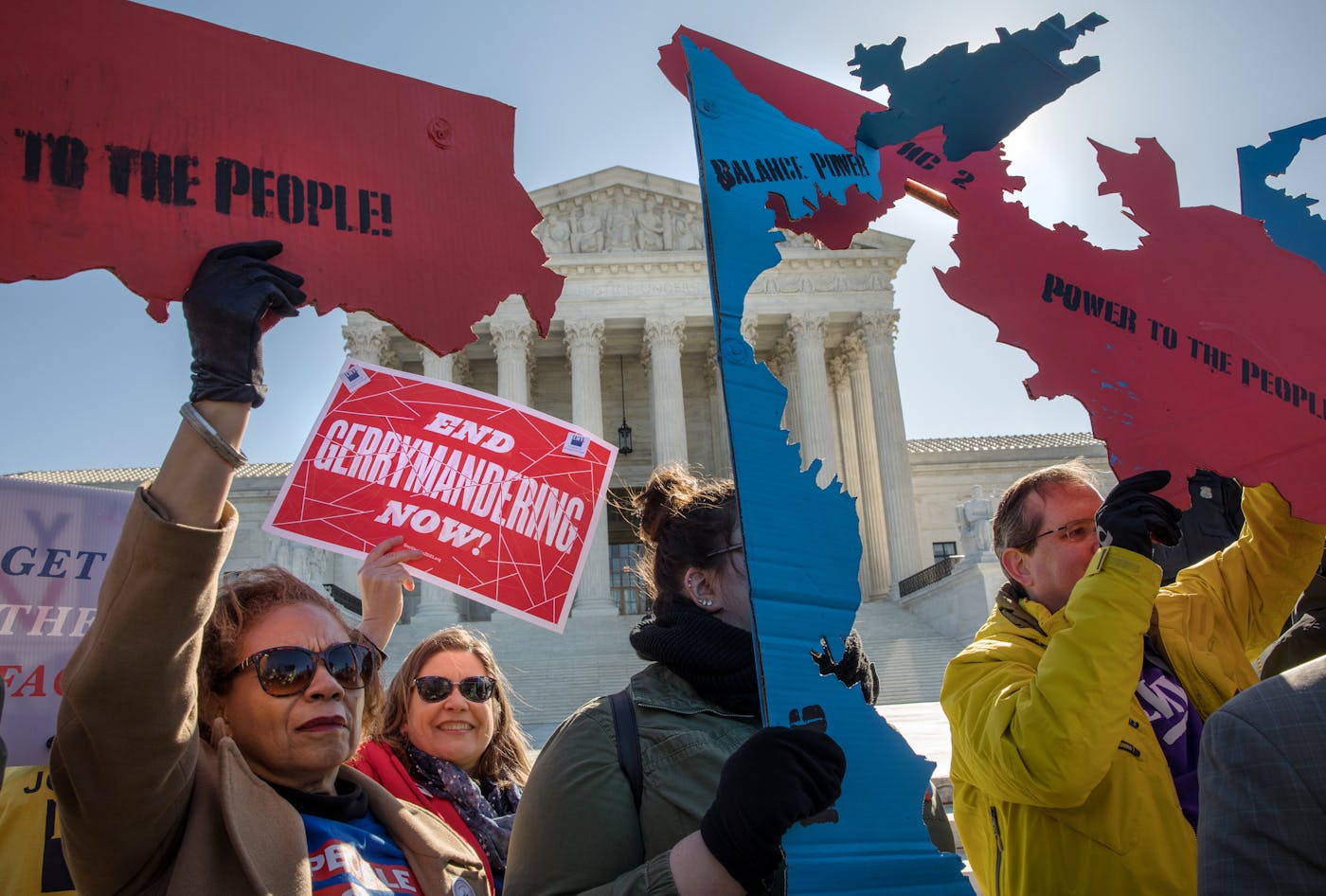 A photo of protesters at the Supreme Court during arguments in the gerrymandering cases Lamone v. Benisek and Rucho v. Common Cause in 2019.