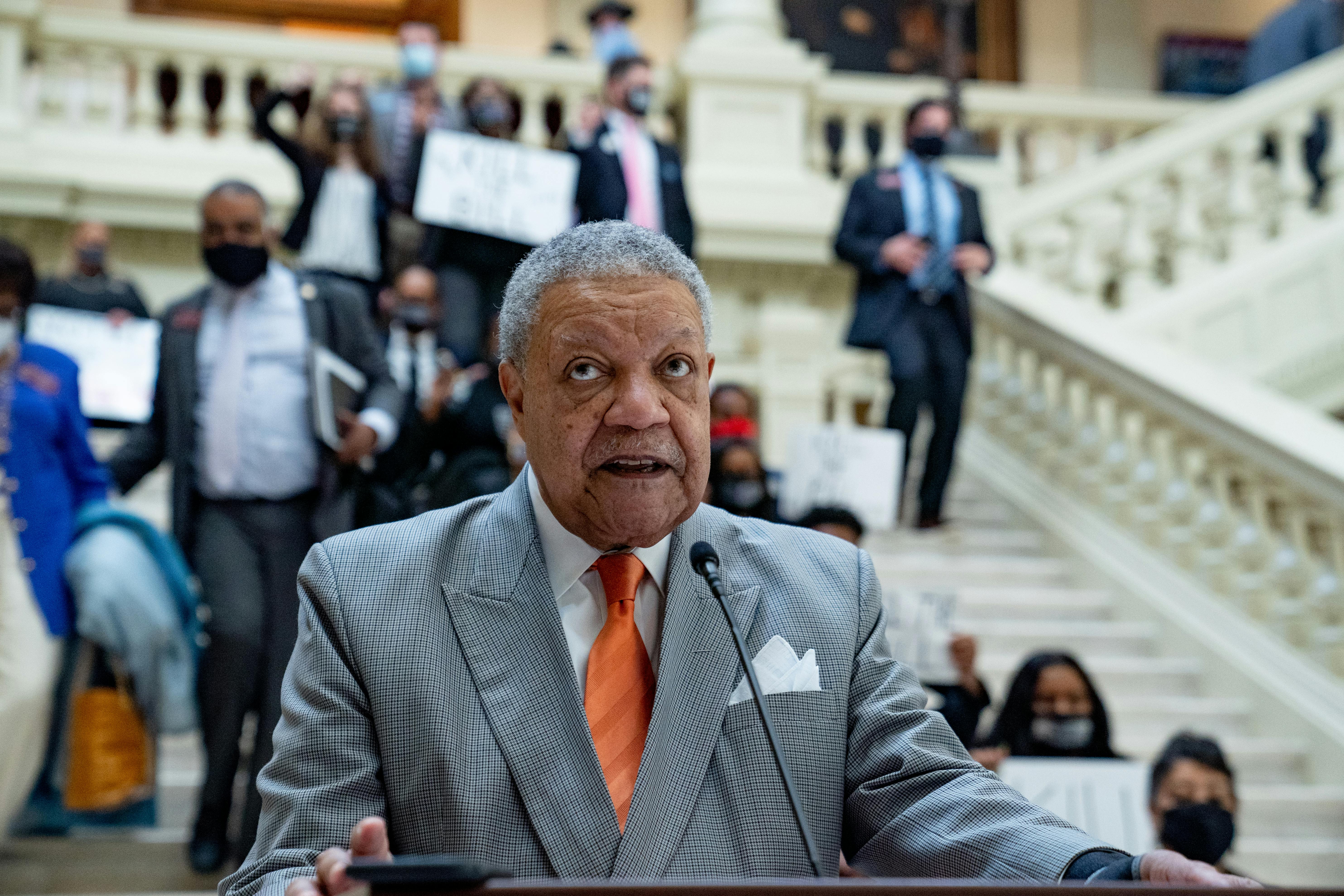 Fulton County Board of Commissioners Chairman Robb Pitts speaks at a lectern.