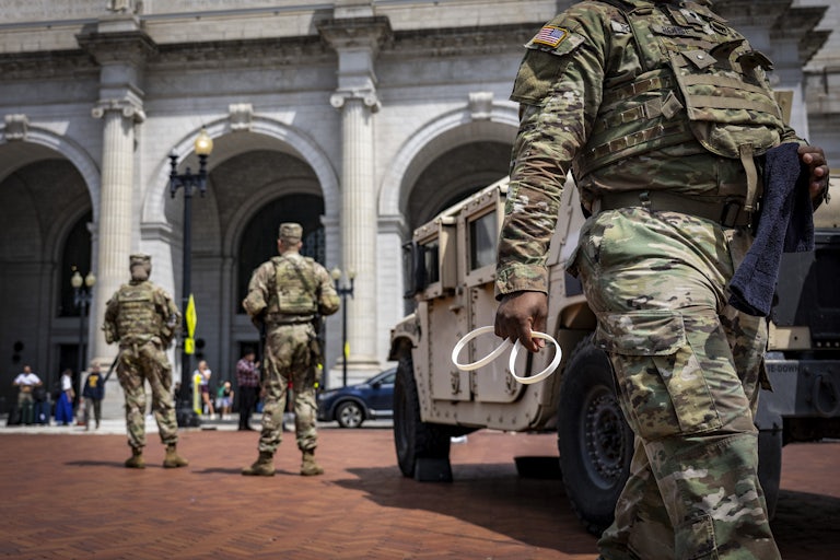 Federal troops stand outside a building in Washington, D.C.