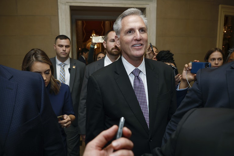 Rep. Kevin McCarthy smiles as reporters surround him