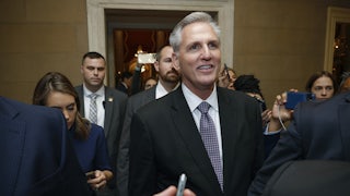 Rep. Kevin McCarthy smiles as reporters surround him
