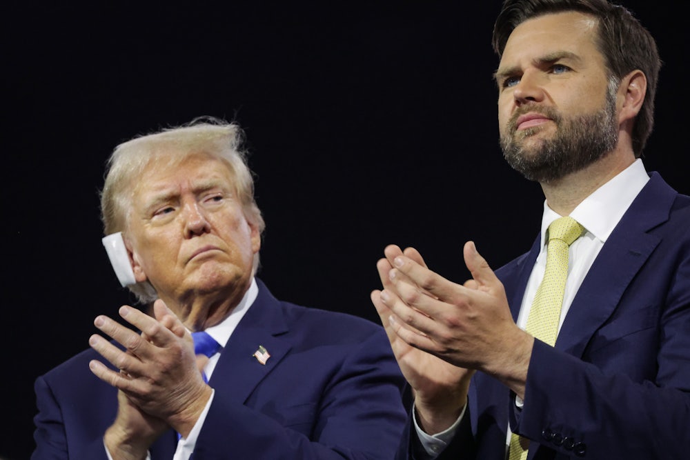 Donald Trump looks warily at his running mate J.D. Vance as the two applaud