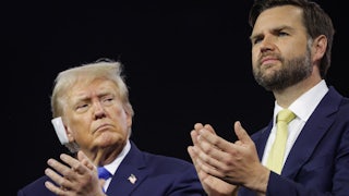Donald Trump looks warily at his running mate J.D. Vance as the two applaud