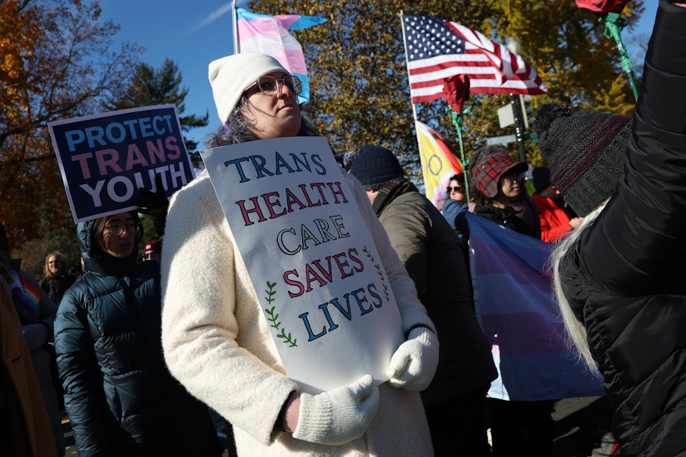 Transgender rights supporters rally outside of the U.S. Supreme Court as the high court hears arguments in a case on transgender health rights in Washington, D.C.