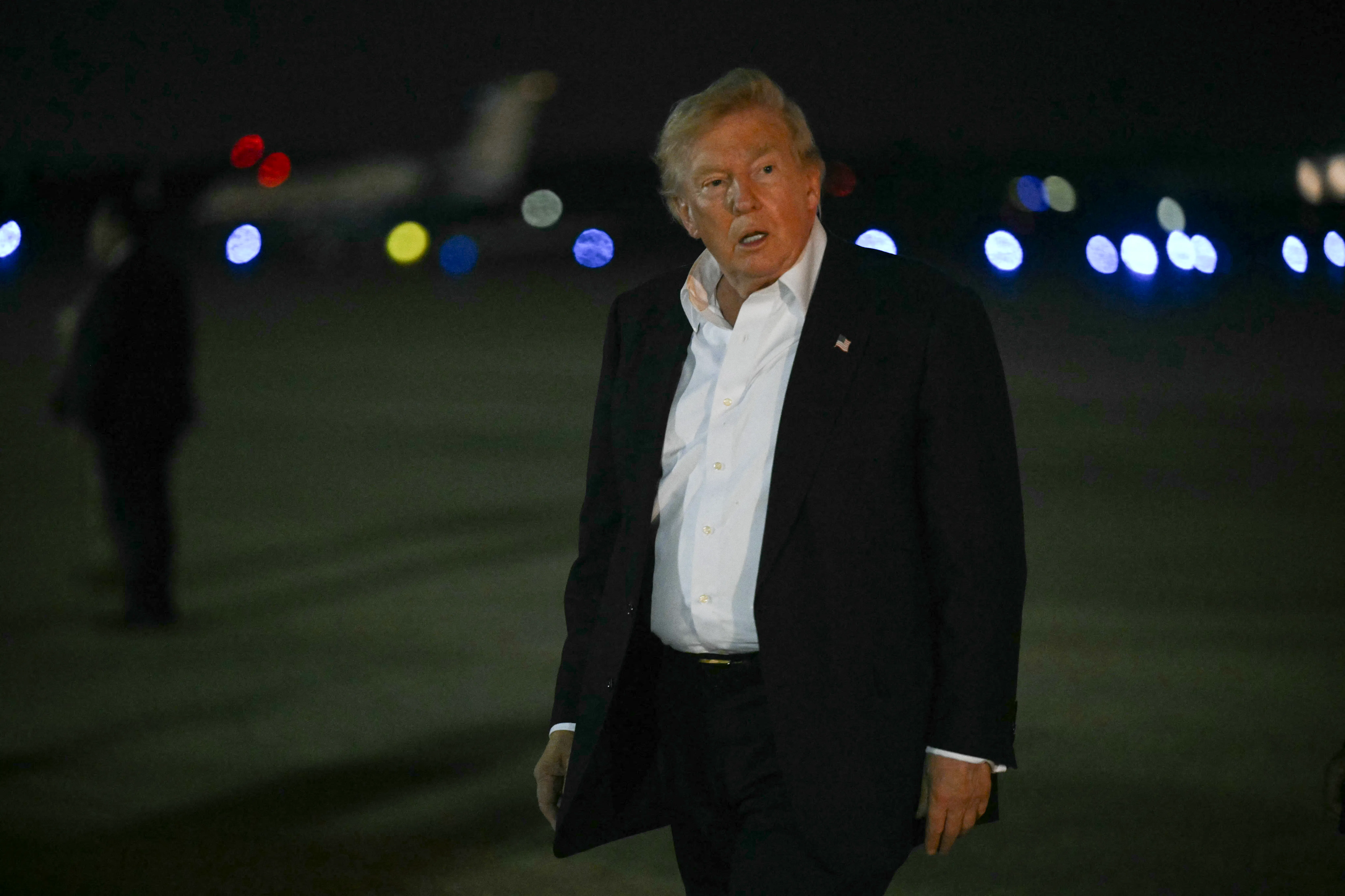 Donald Trump walks after disembarking from Air Force One.