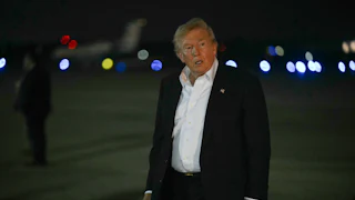 Donald Trump walks after disembarking from Air Force One.