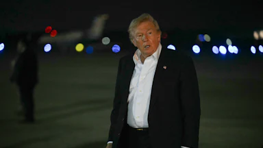 Donald Trump walks after disembarking from Air Force One.