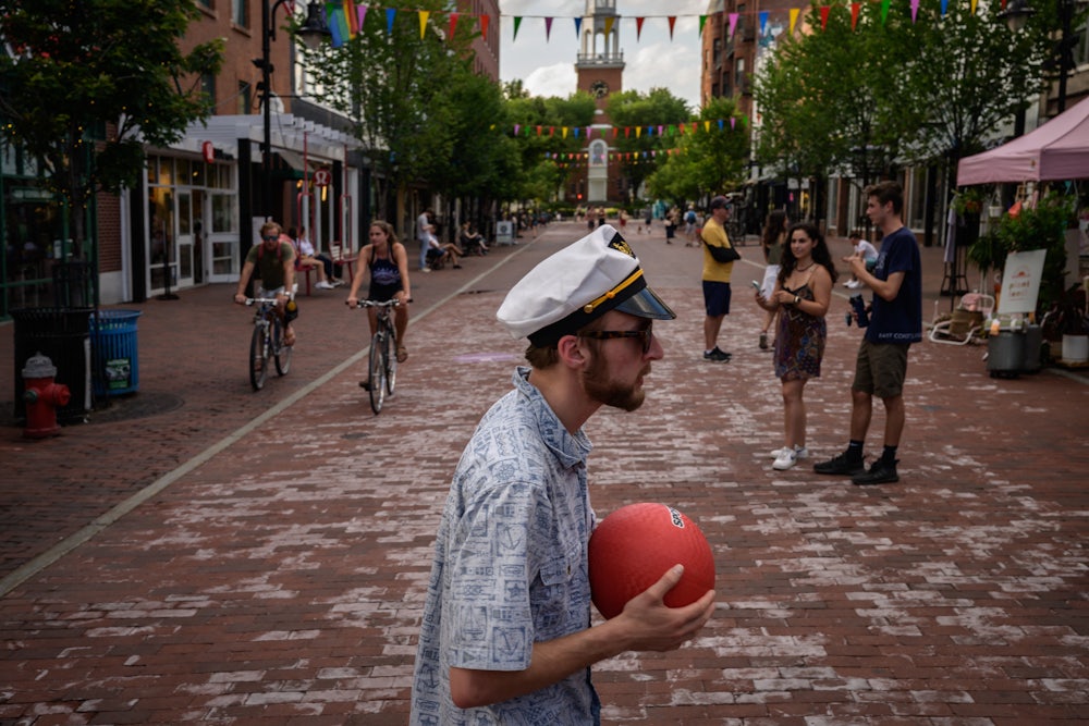 People walk along Church street in Burlington, Vermont