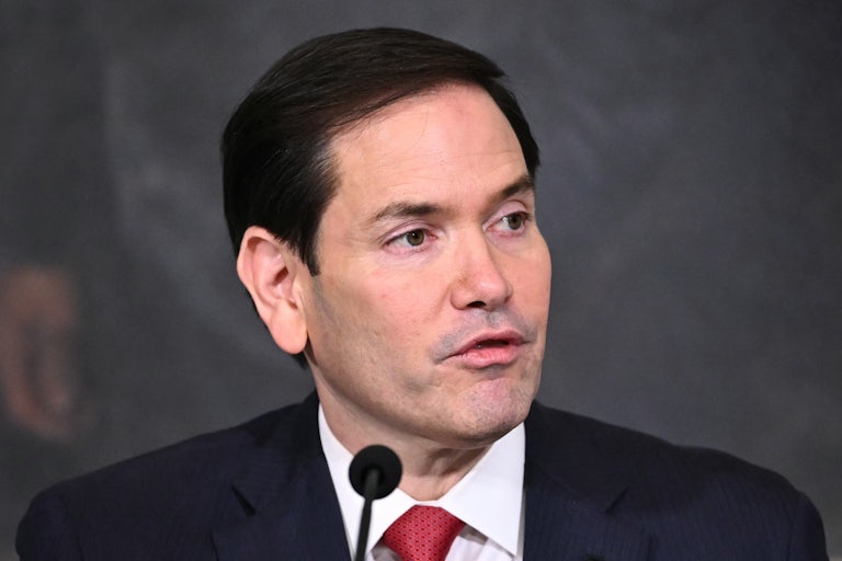 Secretary of State Marco Rubio speaks at a mic.