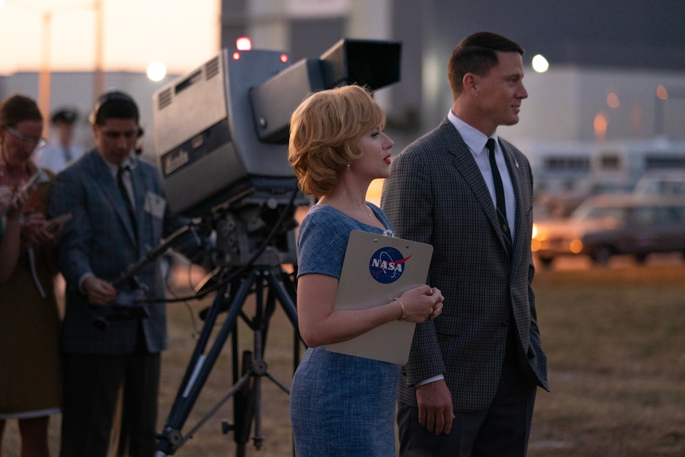 An episodic photograph from the movie Fly Me to the Moon featuring the character con artist-turned-advertising executive Kelly Jones (played by actress Scarlett Johansson) and a decent, broad-shouldered astronaut played by actor Channing Tatum