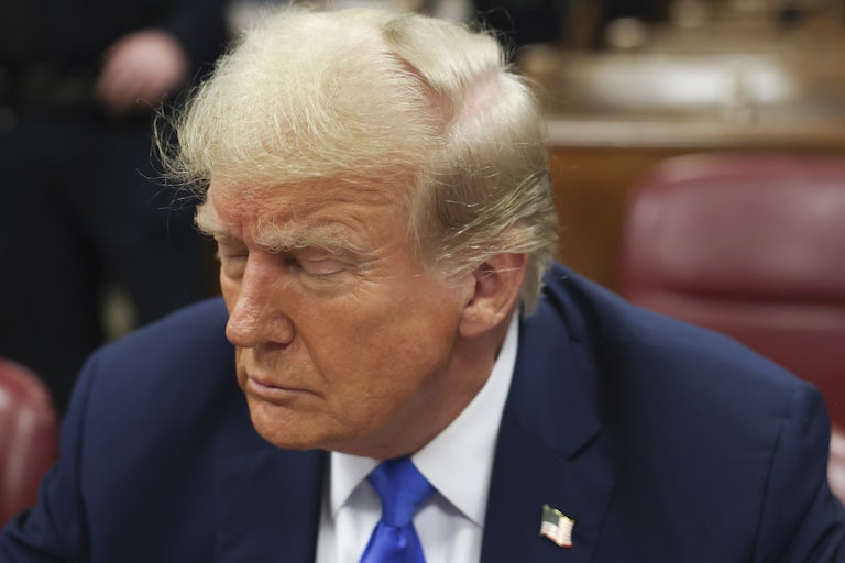 Donald Trump sits with his eyes closed