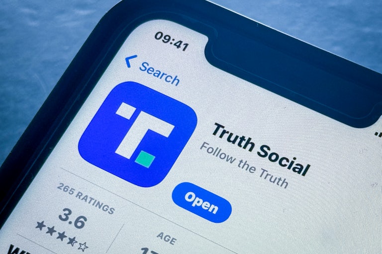 The Truth Social App Store page is seen on a phone