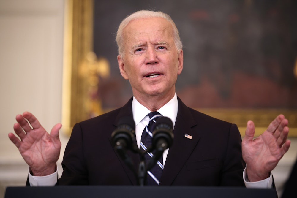 Joe Biden speaks at a podium.