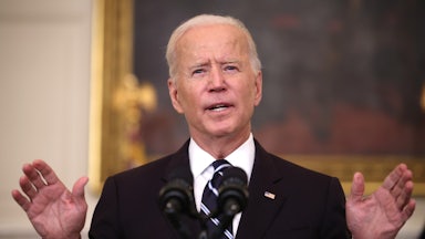 Joe Biden speaks at a podium.