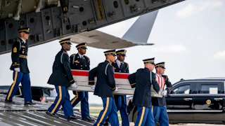 Members of the U.S. Army carry out a dignified transfer at Dover Air Force Base.