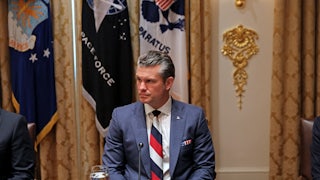 Defense Secretary Pete Hegseth sits at a formal place setting during a lunch meeting between Donald Trump and Ukrainian President Volodymyr Zelenskiy