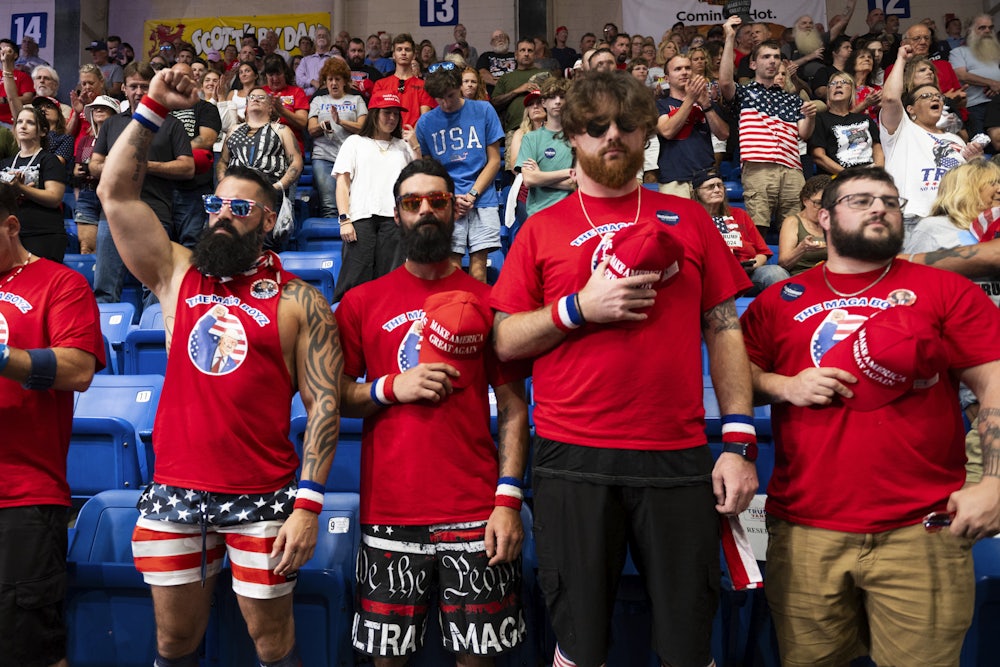 Nick Passano, left, a Millennial cryptocurrency investor, pumps his fist in the air during a political rally where Donald Trump spoke during a campaign stop in Johnstown, Pennsylvania on August 30, 2024,