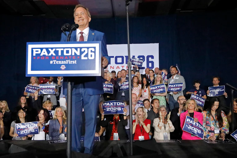 Texas Attorney General Ken Paxton speaks at a podium at his election night watch party