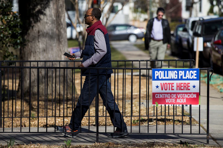 A man walks to a polling place to cast his vote.