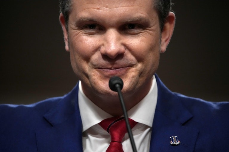 Pete Hegseth smiles in his confirmation hearing
