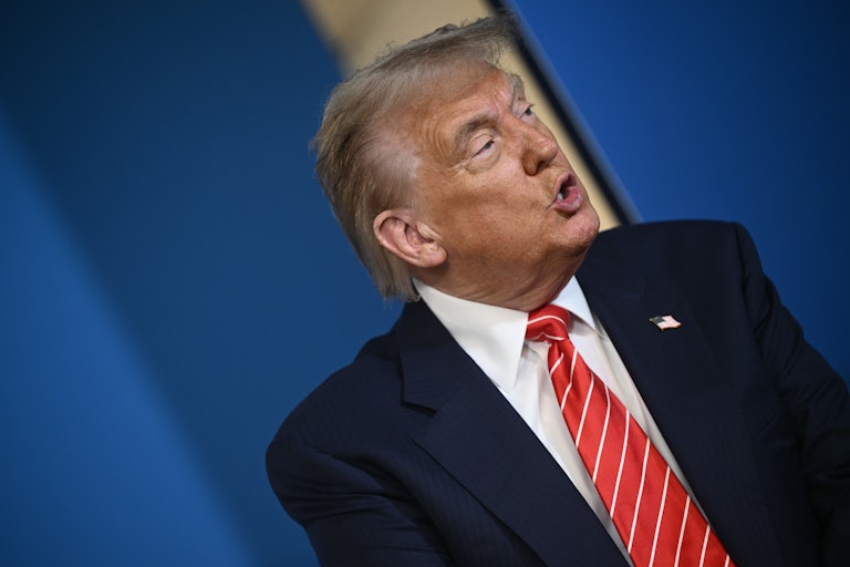 Donald Trump speaks to reporters during the NATO summit at The Hague