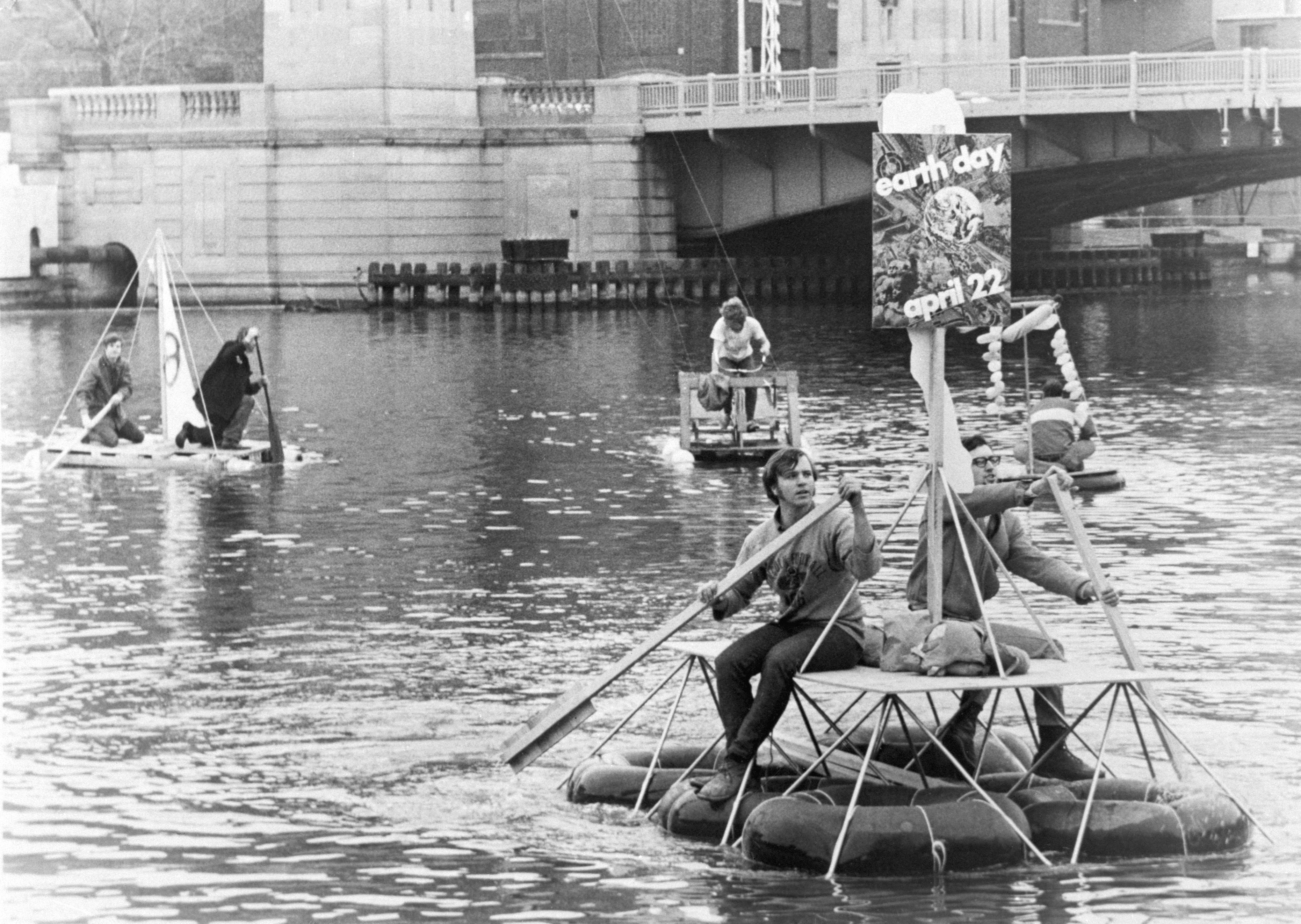 Students paddle down the Milwaukee River on homemade rafts