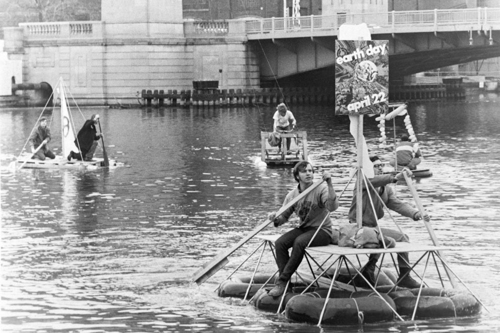 Students paddle down the Milwaukee River on homemade rafts
